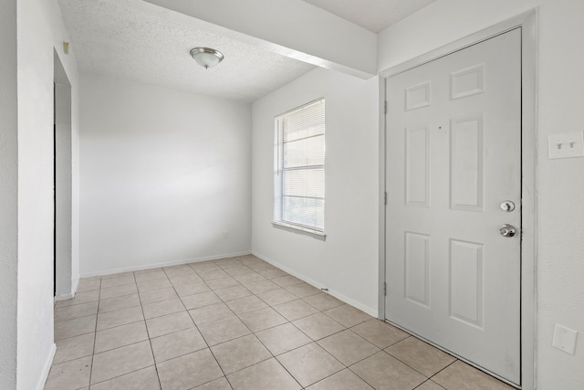 interior space featuring a textured ceiling