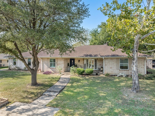 ranch-style home featuring a front yard