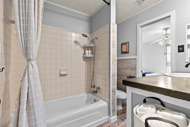 full bathroom with wood-type flooring, a textured ceiling, toilet, vanity, and shower / tub combo