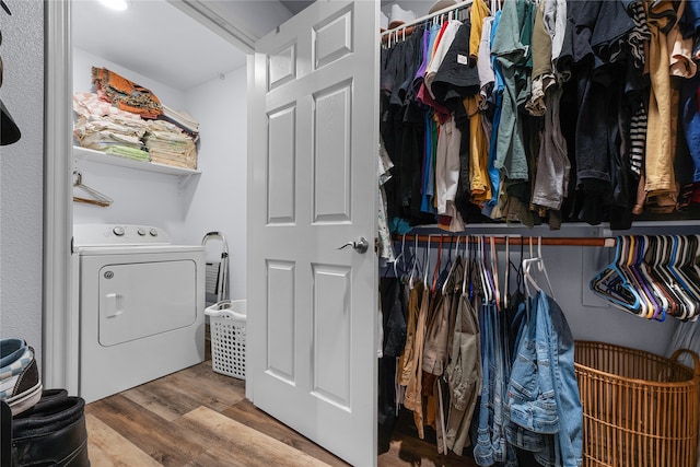 laundry room featuring washer / dryer and wood-type flooring