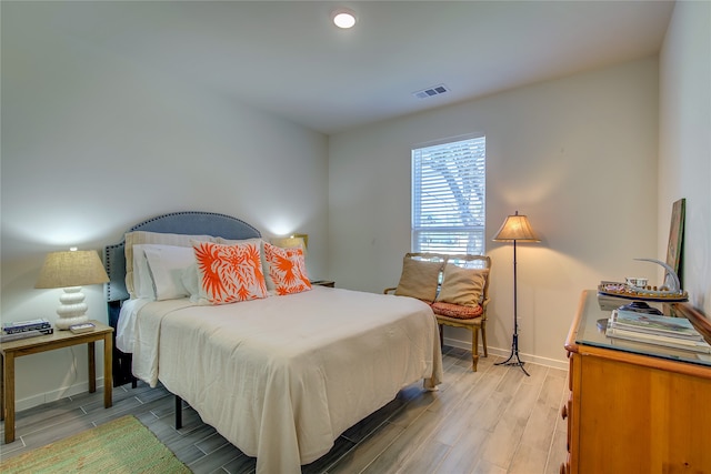 bedroom with light wood-type flooring