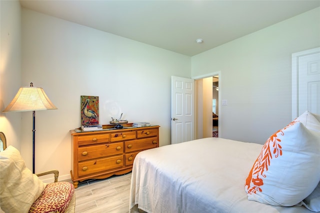 bedroom with light hardwood / wood-style floors