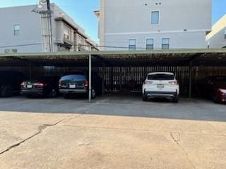 view of parking / parking lot featuring a carport