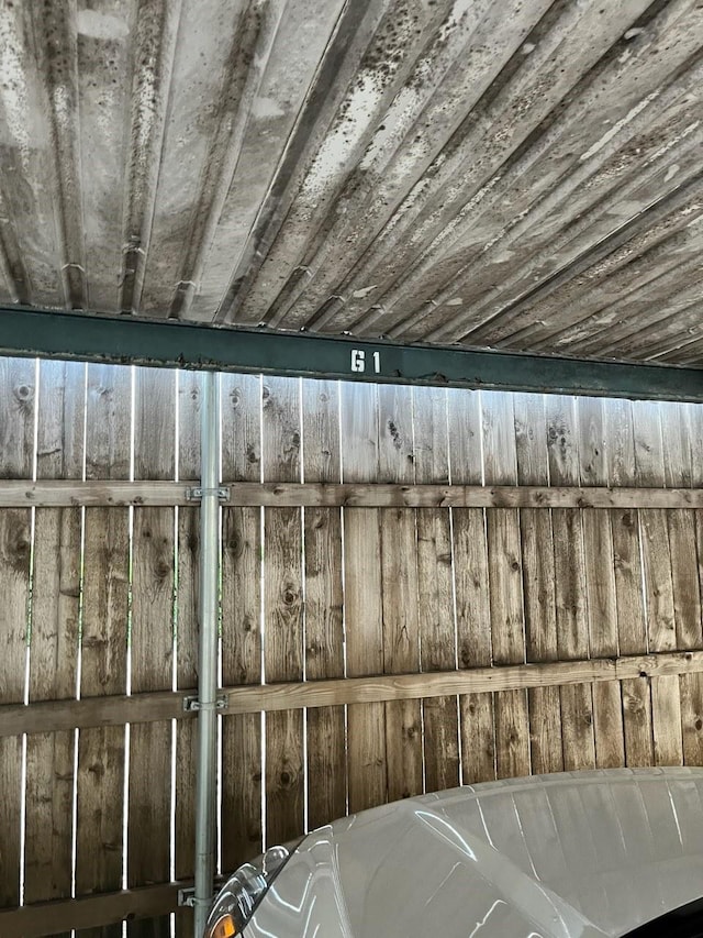 room details featuring wood ceiling and wooden walls