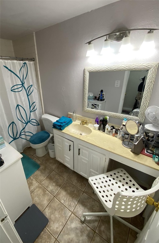 bathroom with vanity, tile patterned flooring, and walk in shower