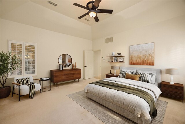 unfurnished bedroom featuring connected bathroom, vaulted ceiling, light colored carpet, and ceiling fan