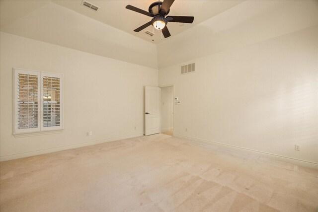 unfurnished room with high vaulted ceiling, light carpet, and ceiling fan