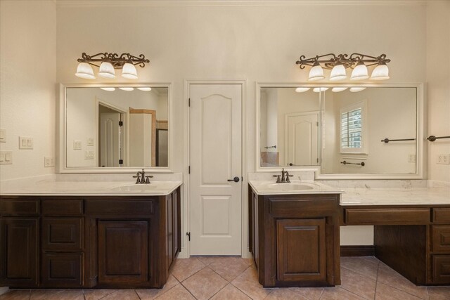 bathroom with tile patterned flooring and vanity