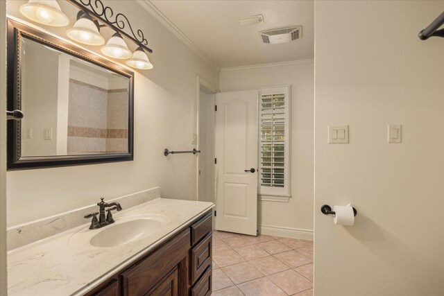 bathroom with vanity, ornamental molding, tile patterned flooring, and visible vents