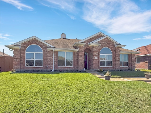 ranch-style home featuring a front yard