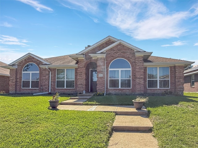 ranch-style house with a front yard