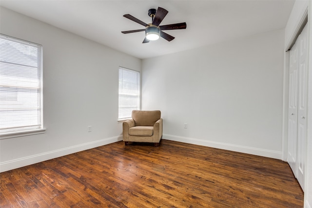 unfurnished room with ceiling fan, a wealth of natural light, and dark hardwood / wood-style floors