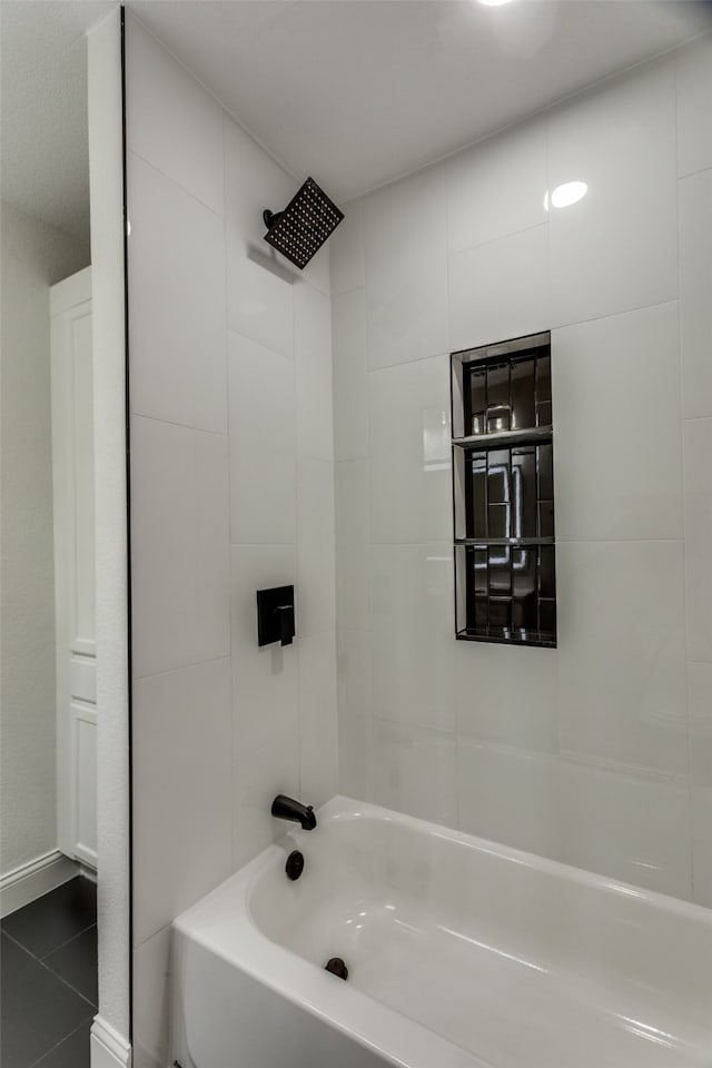 bathroom with shower / tub combination and tile patterned flooring