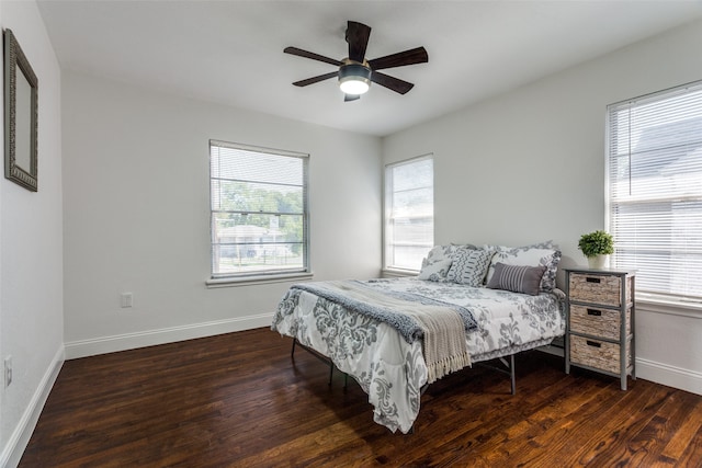 bedroom featuring ceiling fan and dark wood-type flooring