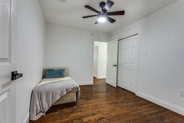 bedroom featuring a closet, ceiling fan, and dark hardwood / wood-style flooring