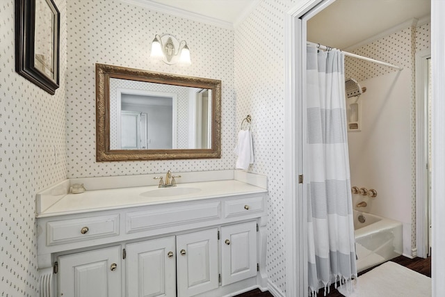 bathroom with ornamental molding, shower / bath combo with shower curtain, vanity, and wood-type flooring