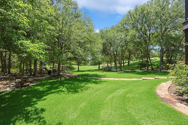 view of property's community with a yard