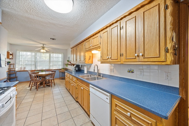 kitchen with white appliances, light tile patterned flooring, sink, backsplash, and ceiling fan