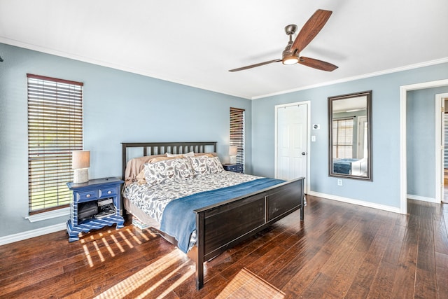 bedroom with ornamental molding, ceiling fan, and dark hardwood / wood-style flooring