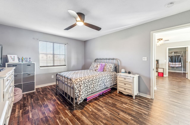 bedroom featuring ceiling fan and dark hardwood / wood-style floors