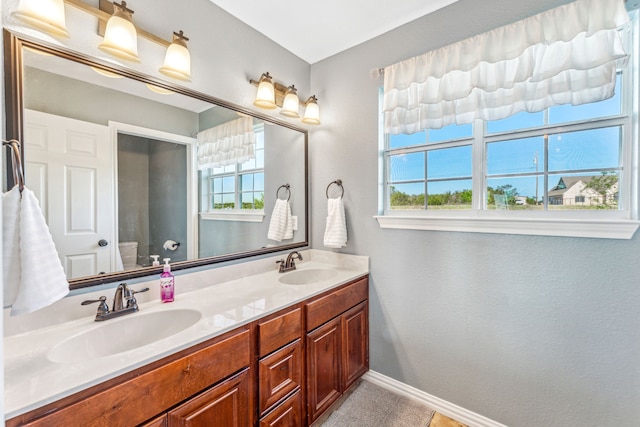 bathroom featuring vanity and toilet