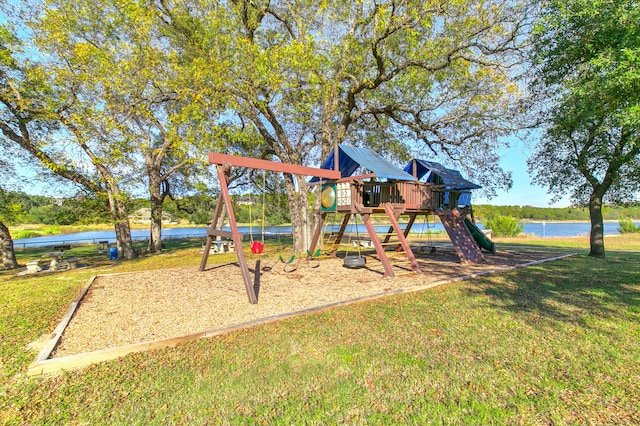 view of play area featuring a water view and a lawn