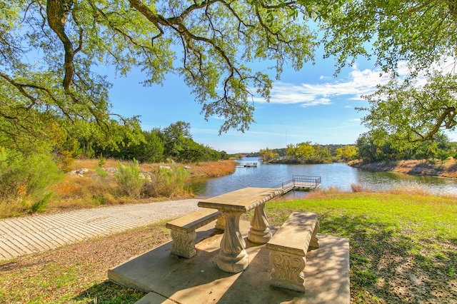 surrounding community with a water view