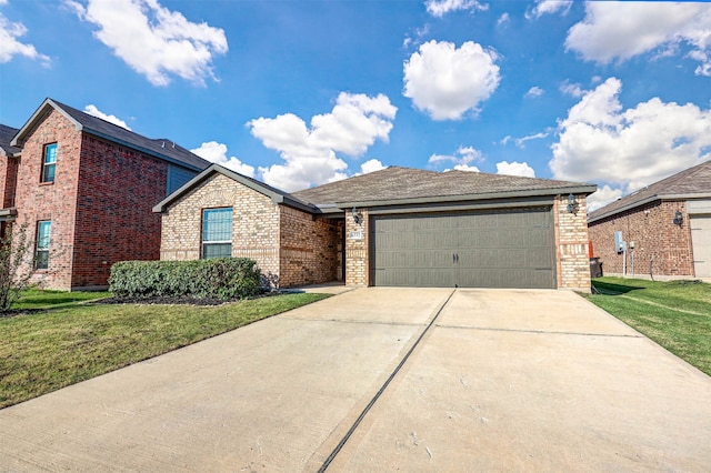 view of front of property featuring a garage and a front lawn