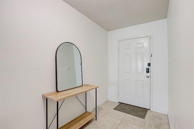 entrance foyer with light tile patterned floors