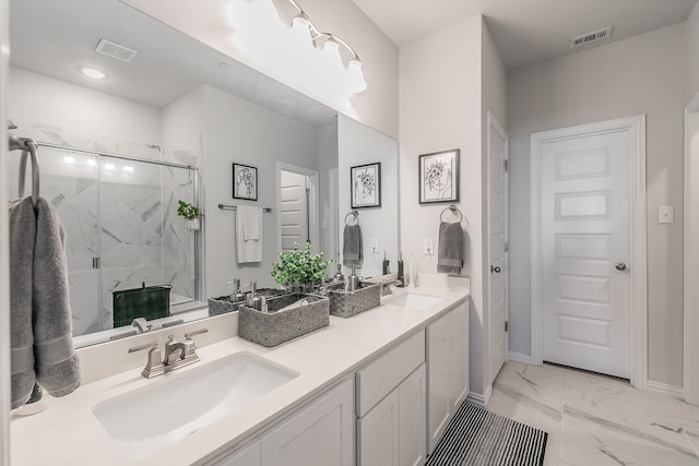 bathroom featuring vanity and a shower with shower door