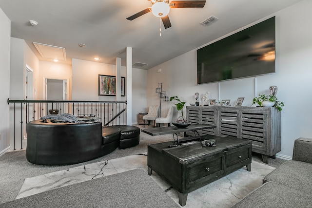 carpeted living room featuring ceiling fan