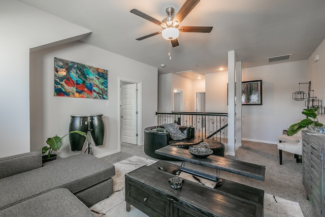 carpeted living room featuring ceiling fan