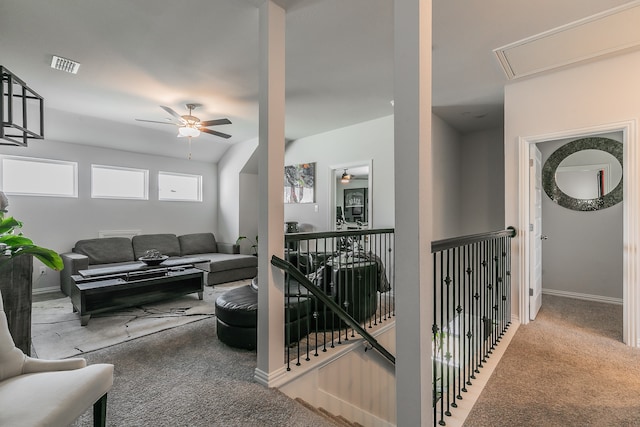 carpeted living room featuring ceiling fan