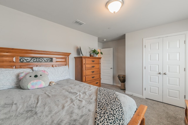 carpeted bedroom featuring a closet