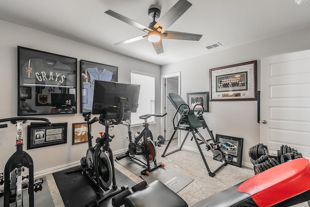 exercise room featuring ceiling fan and carpet floors