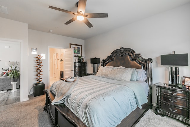 bedroom featuring ceiling fan and light carpet