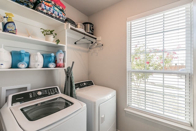 clothes washing area with independent washer and dryer