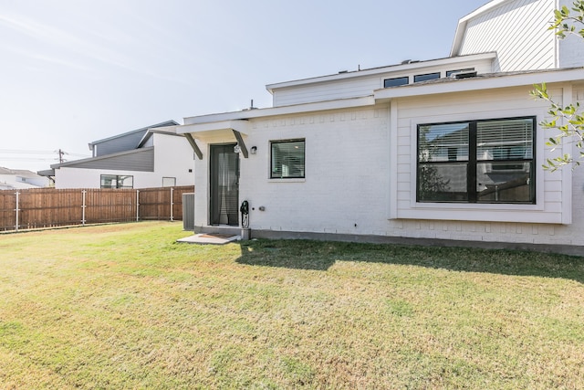 back of house with a yard