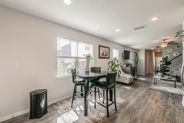 dining area with ceiling fan and hardwood / wood-style floors