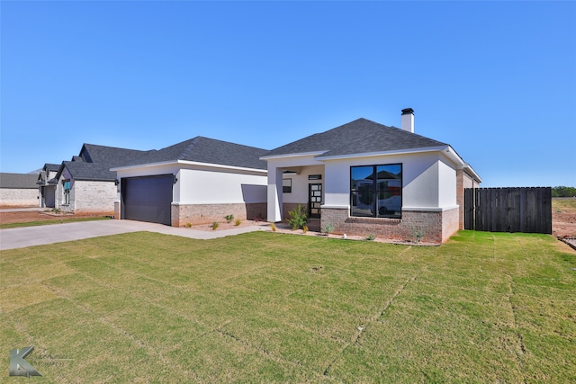 view of front of home featuring a front yard, a porch, and a garage