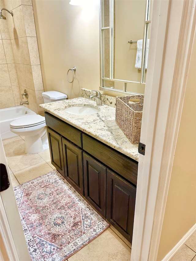 full bathroom featuring vanity, toilet, tile patterned floors, and tiled shower / bath