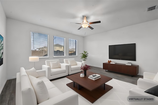 living room with hardwood / wood-style floors and ceiling fan