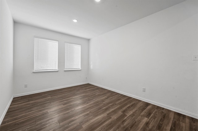 empty room featuring dark hardwood / wood-style flooring