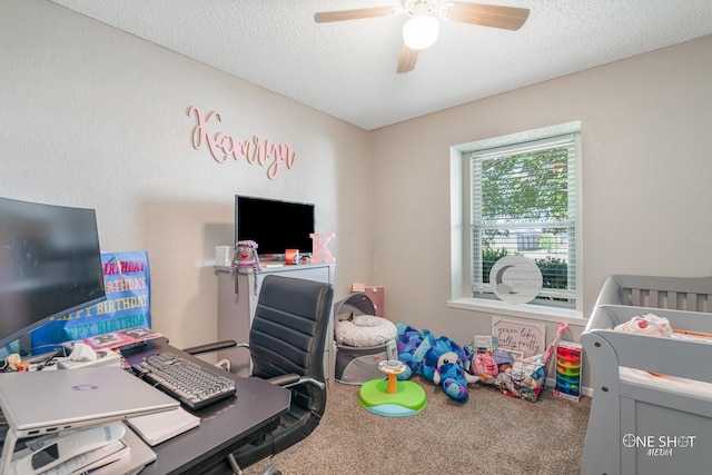 carpeted bedroom featuring a ceiling fan and a textured ceiling