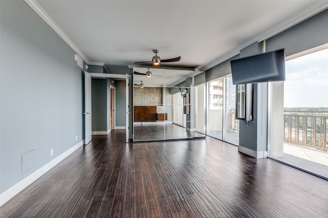 unfurnished living room with ornamental molding, a healthy amount of sunlight, ceiling fan, and dark hardwood / wood-style flooring