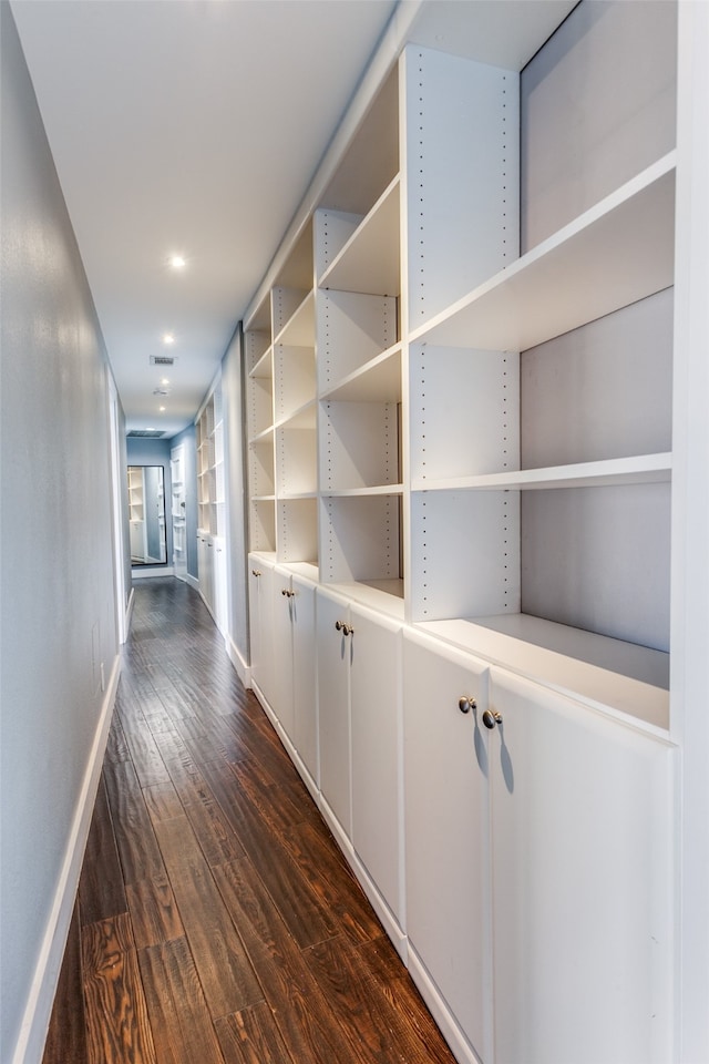 hallway featuring dark hardwood / wood-style flooring