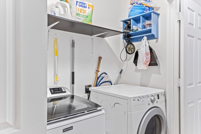 laundry room featuring washing machine and dryer