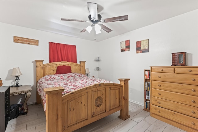 bedroom with ceiling fan and light wood-type flooring