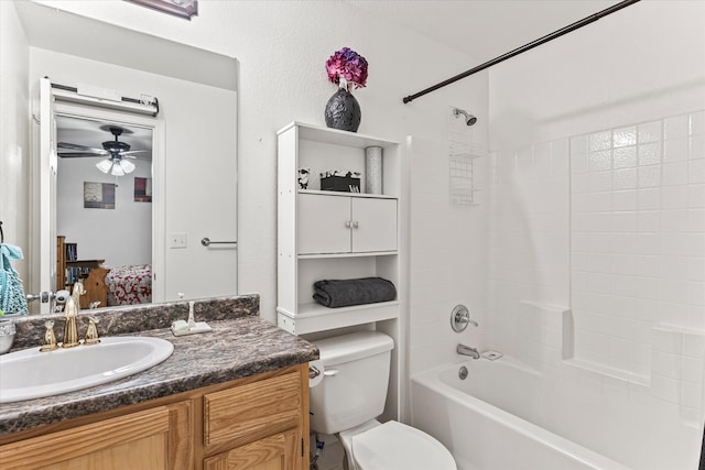 full bathroom with vanity, shower / bath combination, toilet, and ceiling fan