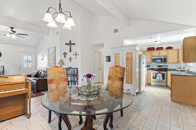 dining room featuring beamed ceiling, ceiling fan with notable chandelier, and high vaulted ceiling